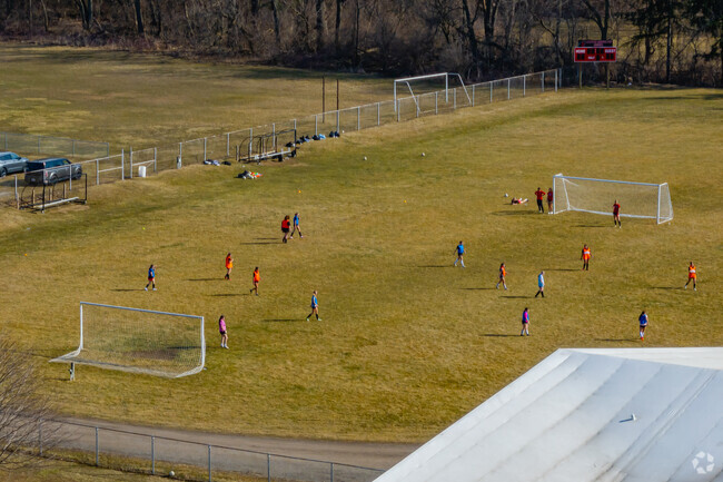 Clinton Middle School features a large athletics area behind the school for student programs.