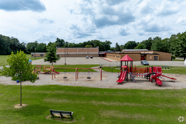 Benches for teachers are placed around Townsend Elementary School's playgrounds.