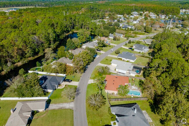 This row of homes in Marketplace is surrounded by lush mature trees.