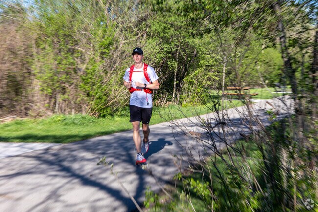 Runners enjoy Gallup Park's loop in Ann Arbor Hills.