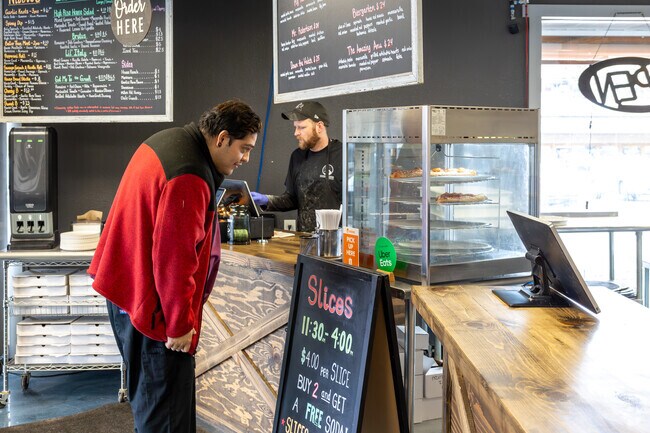 Have some pizza at High Rise Pizza, they are on just east of the Oak Hills neighborhood.