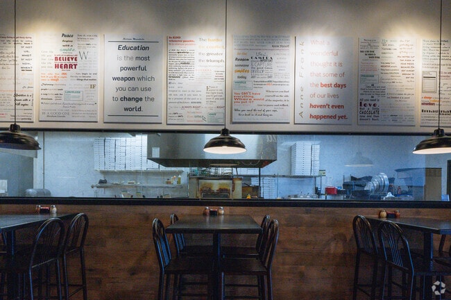 B. Antonio's Pizza has a wall of quotes you can read while you eat, next to Arlington Park.