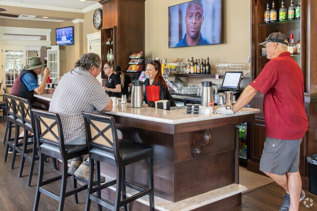 Wildflower residents who golf enjoy drinks and laughter at the Kings Country Club bar.