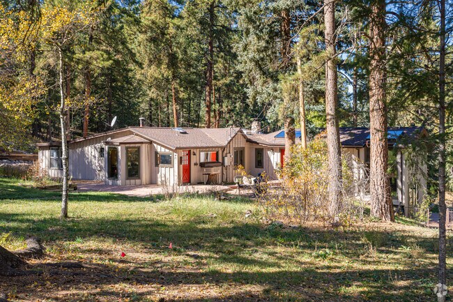A mid-20th century ranch style home in Deer Creek is tucked away in the pine trees.