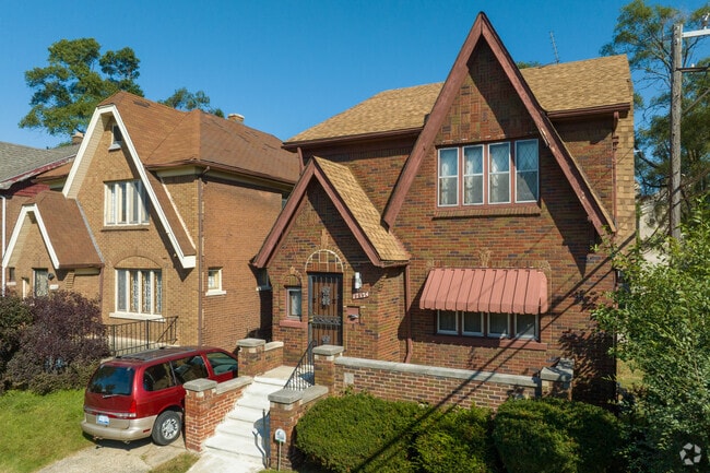 Accentuated peaks on these brick Tudors, in Pilgrim Village, give them distinct style and stature.