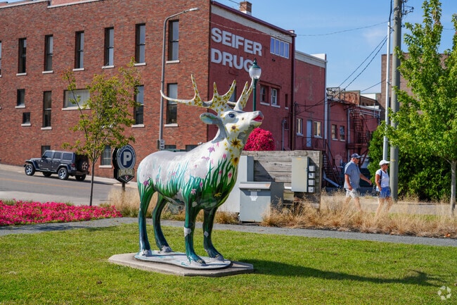 Elk statues can be found throughout Christiana Creek to represent the history of Elkhart.