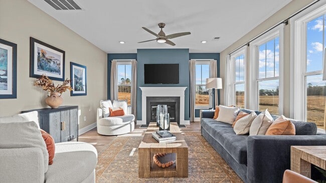 Vibrant and welcoming family room anchored by clean lines, tasteful materials, and abundant light