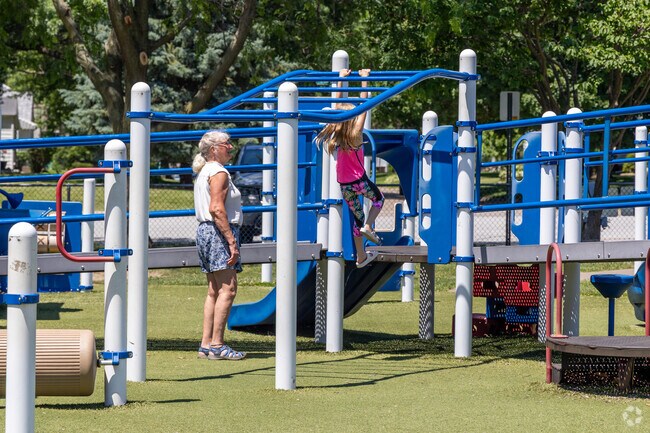 Families enjoy the playground at McManus Park in Downtown Bettendorf.