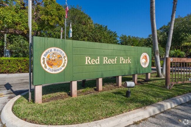 Explore vibrant gardens as waves create a symphony at Red Reef Park by the ocean.