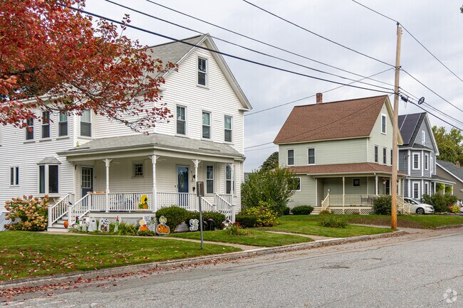 Homes with farmer porches reach to the side walk in North Chelmsford.
