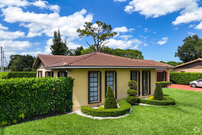 There are maintained front yards for the traditional single-family homes in Scott Lake Manor.