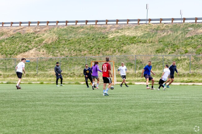 Friends enjoy a game of soccer in Cherry Creek.