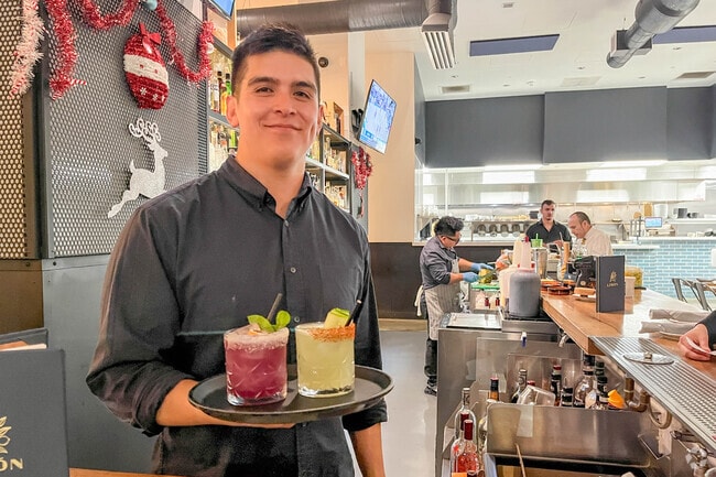 Bartenders at Limon in Oakland prepare craft cocktails for guests all evening.