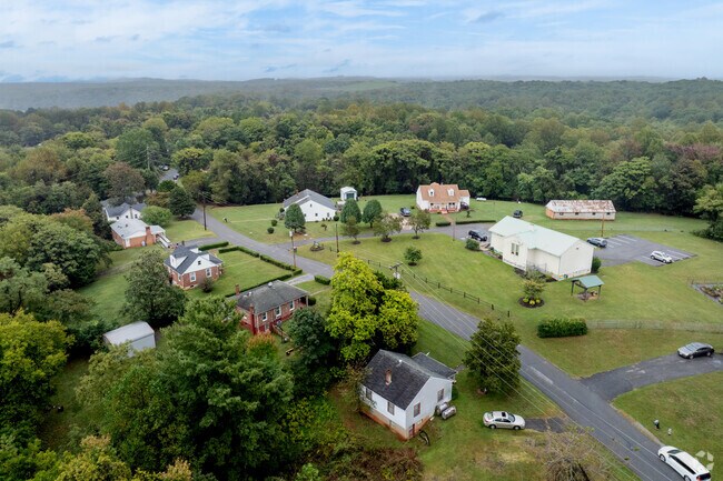Several roads lined with homes wind through tree-covered Winston Ridge.