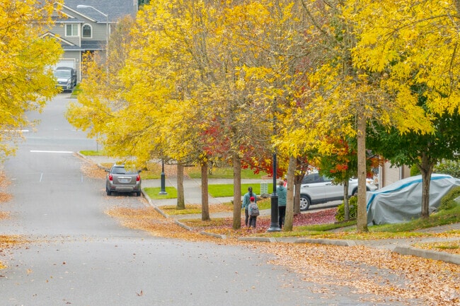 Locals walk the colorful streets of The Lakes WA.