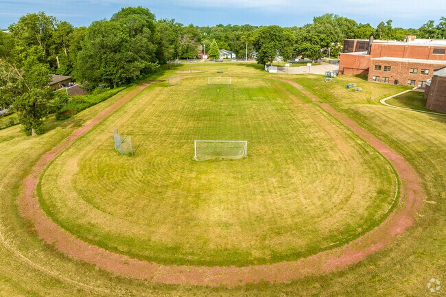 A dirt track and soccer field are also part of the school grounds.