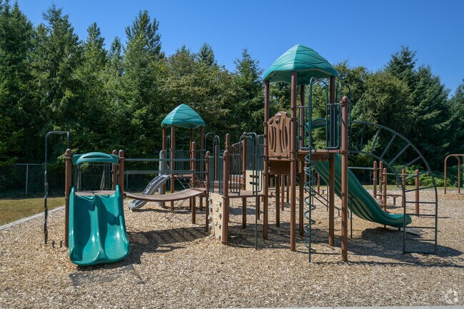 Play equipment with some slides at the playground in St. John Fisher School.