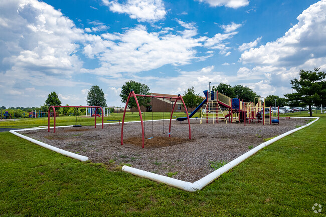 Students at Truman Elementary enjoy a large open green space with lots of playground equipment.