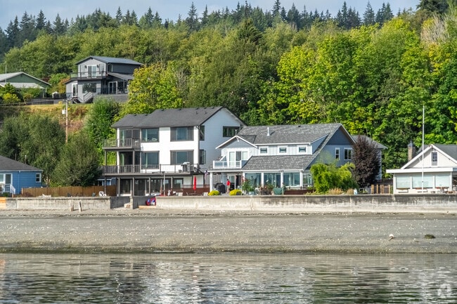 A row of beach front homes in Freeland feature private beach and stunning views.