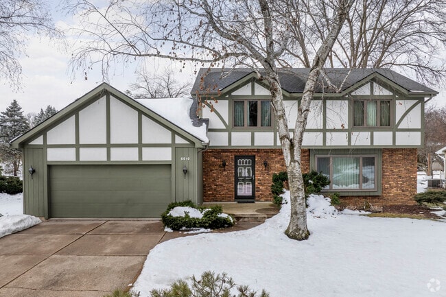Some Tudor-inspired bi-level homes with attached garages also exist in Greentree.