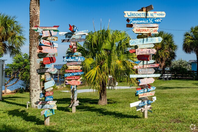 Fun, directional signs at Ryckman Park show the direction of other cities and towns.
