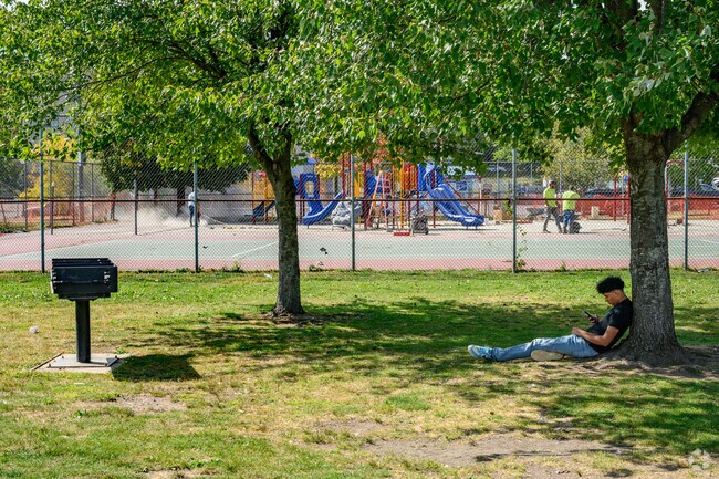 Locals come to Spring Valley Park to relax in the shade or enjoy the playground.