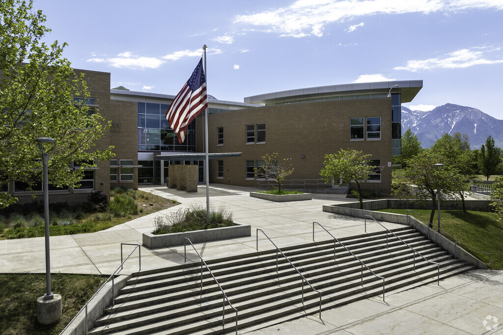 A flag waves gently atop the steps at Hillside Middle School in Ballpark.