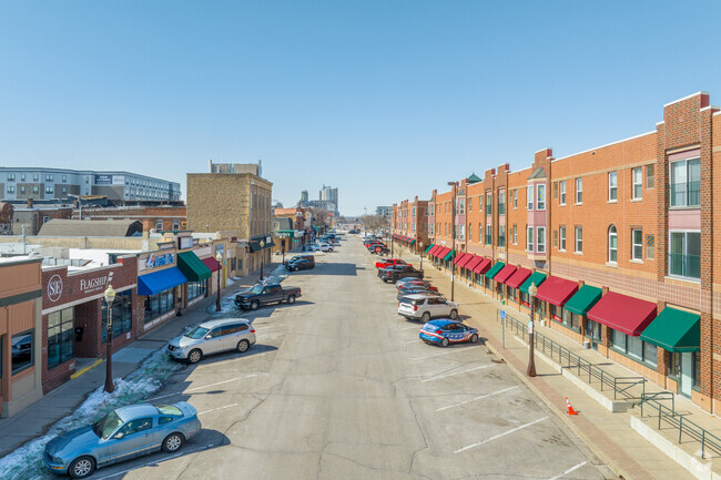 A view down 1st Ave E with historical buildings on the left and Apartments on the right