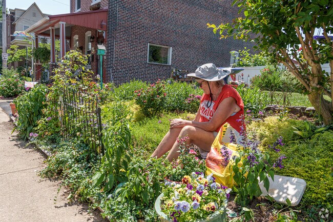 A proud Bayard Square homeowner takes pride in her home's curb appeal with creative gardening.
