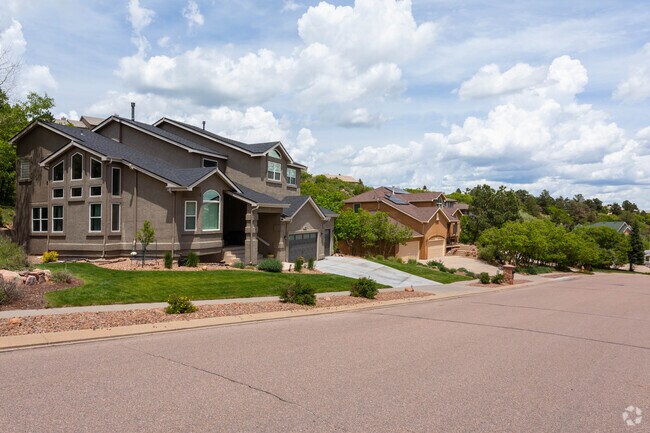 Luxury homes line the hills of Peregrine, many with expansive patios and stunning views.