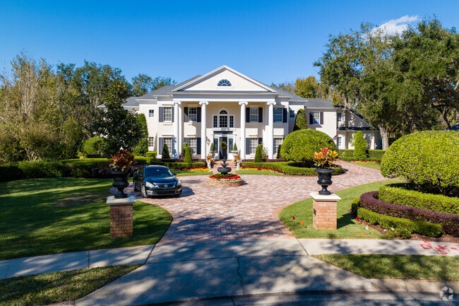 Stately fountains can be found in front of grand, two-story homes in the Lake Conway, FL region.