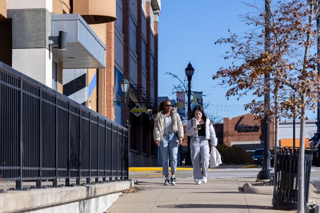 Shoppers stroll through Bender, where modern storefronts, clean sidewalks, and a small-town ease make everyday errands feel a little brighter.