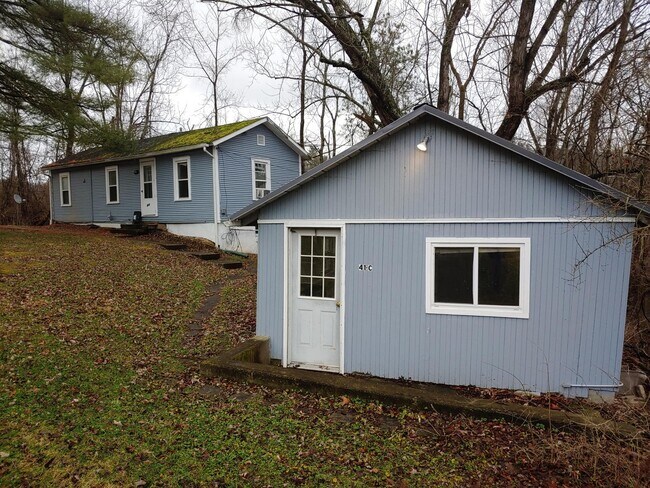 Studio with house in the rear