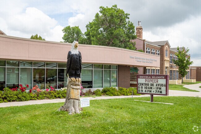 The front sculpture and sign at Pioneer Bilingual Elementary School in Lafayette, Colorado.