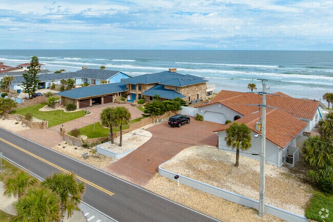 Brick-front homes with generous garage space line the streets of Wilbur By The Sea.
