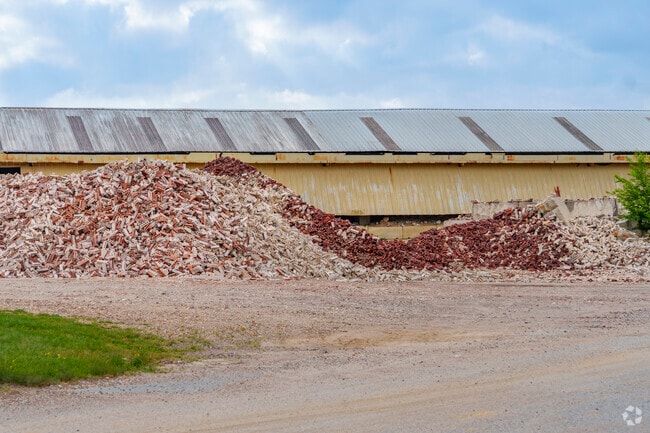 Stacks of freshly made bricks at Acme Brick Company in Malvern, showcasing the city's industrial roots.