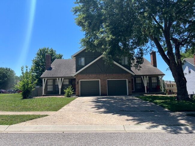 Front of duplex (unit is on the right, large tree has been removed)