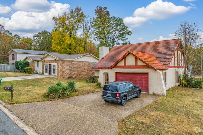 Landmark homes blend Tudor and Ranch styles on spacious, tree-lined lots.