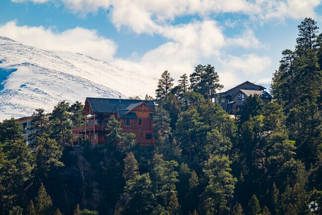 Upper Bear Creek Road winds through towering pines and past serene creekside homes, connecting residents to both the heart of the Evergreen community and the high mountain escapes beyond, where adventure and tranquility meet.