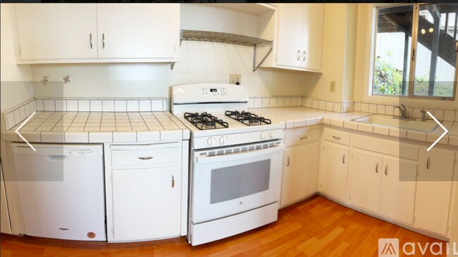 Kitchen with new dishwasher, and gas range