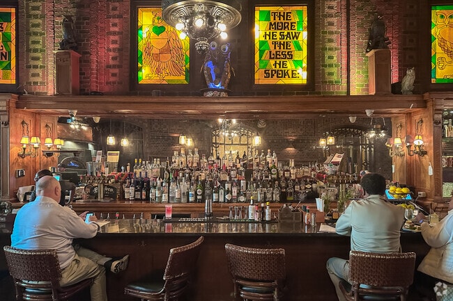 The Owl Bar, where you'll be enchanted by the animatronic owl and the stunning stained glass.