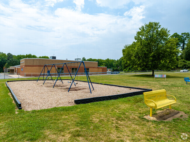 Meet your friends at recess on the swings at Asher Holmes Elementary School.