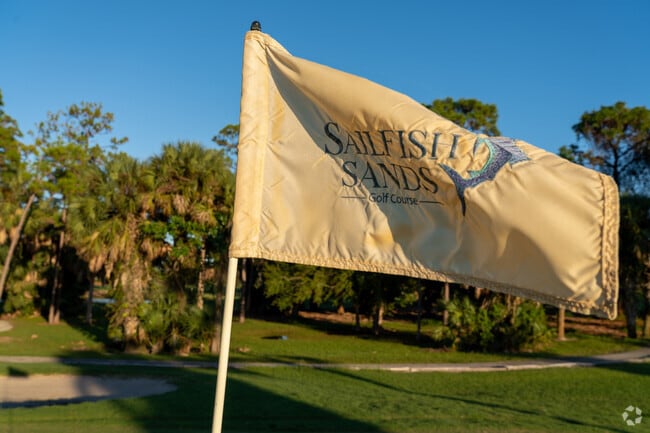 At Sailfish Sands Golf Club, the flag flutters by the hole.