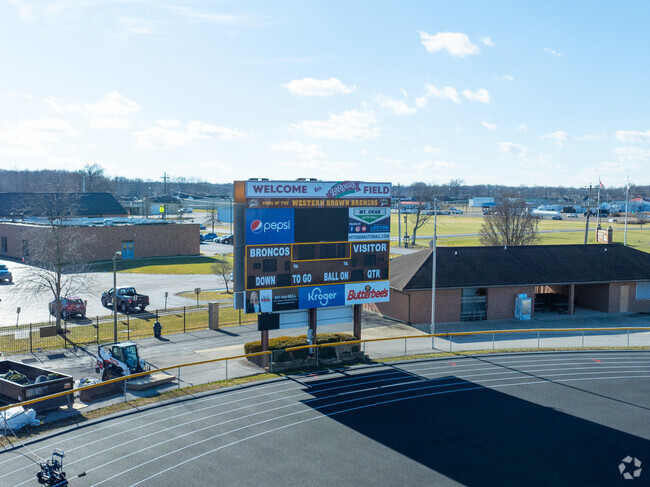 There is a football stadium right near the back of the school.