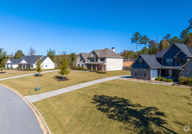 Modern craftsman style homes sit on large plots in Sharpsburg.