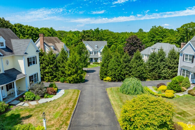 Large Colonial Revivals line the tight streets of neighborhoods in Lewisboro.