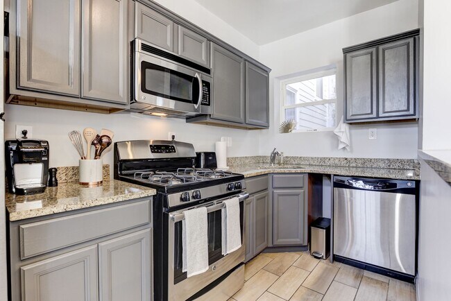 Renovated Kitchen with Granite Counters and Stainless Appliances