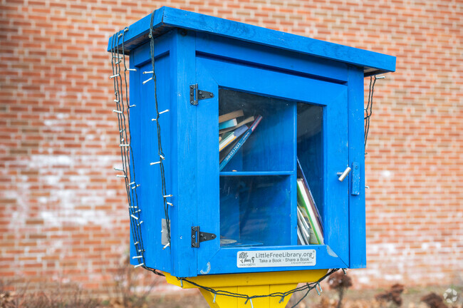 Pick up a book to read at The Little Library at William G Vinal in Norwell.