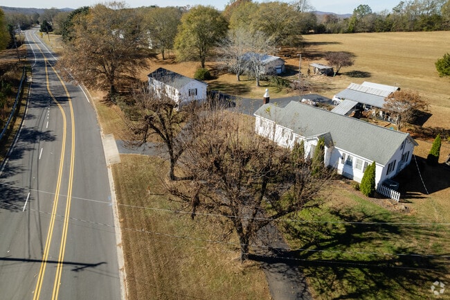 Modern white ranch homes line quiet roadways, reflecting the relaxed pace of life in Holly Springs.