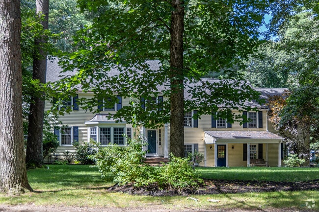 Large Colonial Revival homes with beautiful front yards are typical in the Wayland neighborhood.